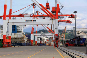 BUSY SUBIC PORT. A stacker truck gets moving at the New Container Terminal in the Subic Bay Freeport, as the Singaporean-registered cargo vessels MV Thana Bhum and MV Spirit of Colombo unload container boxes in this photo taken November 4, 2014.